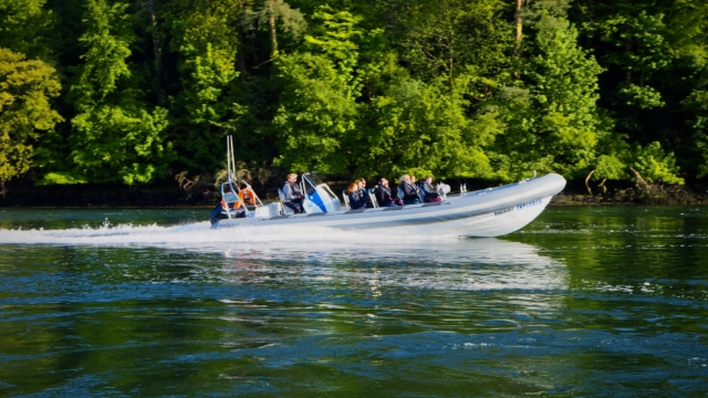 RibRide's Explorer RIB carry passengers travelling right along the tree-lined Menai Strait